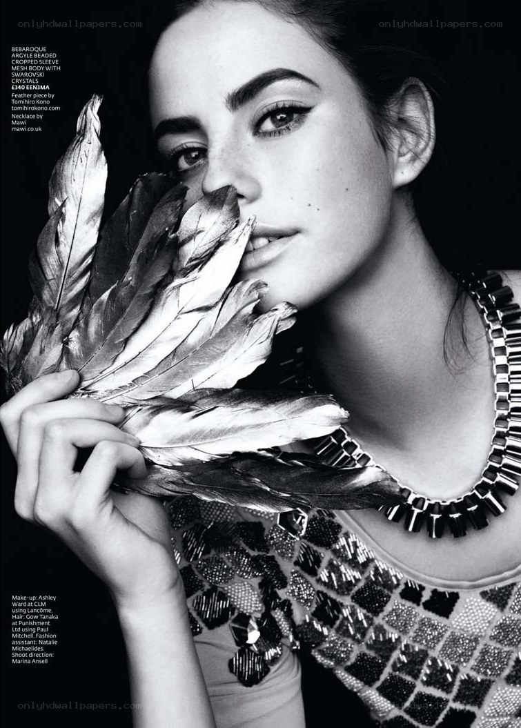 model with feathers and jewelry