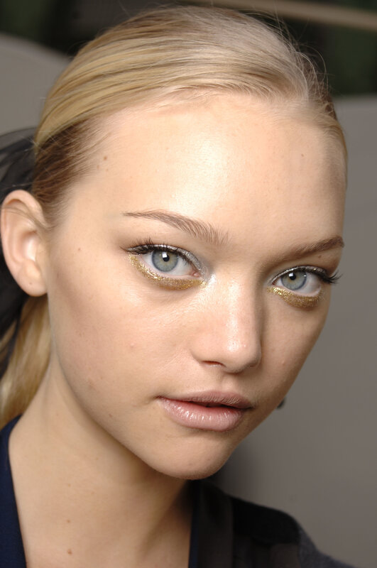 model with gold eye makeup