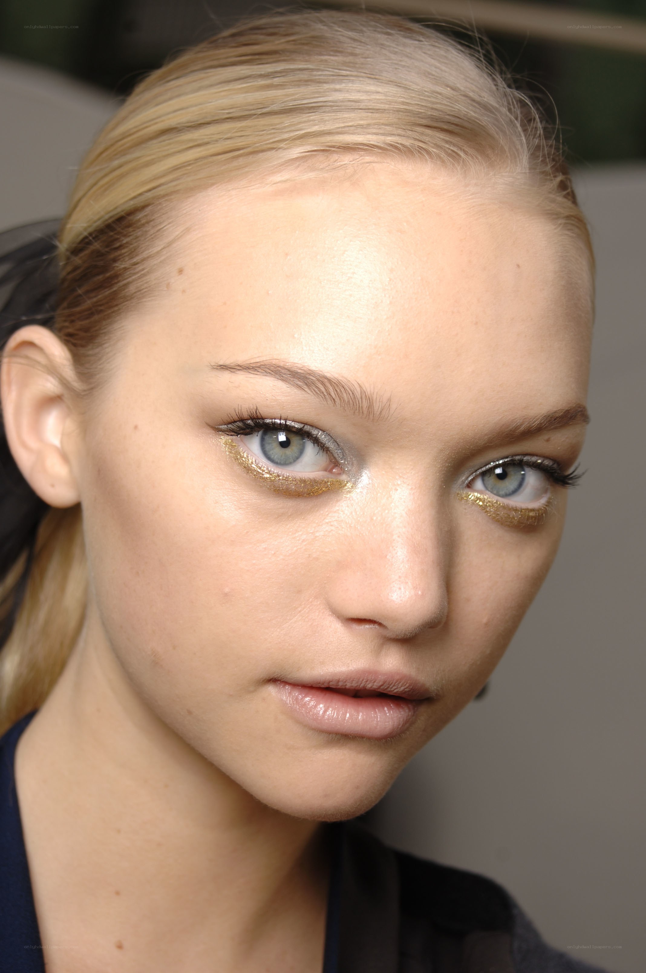 model with gold eye makeup