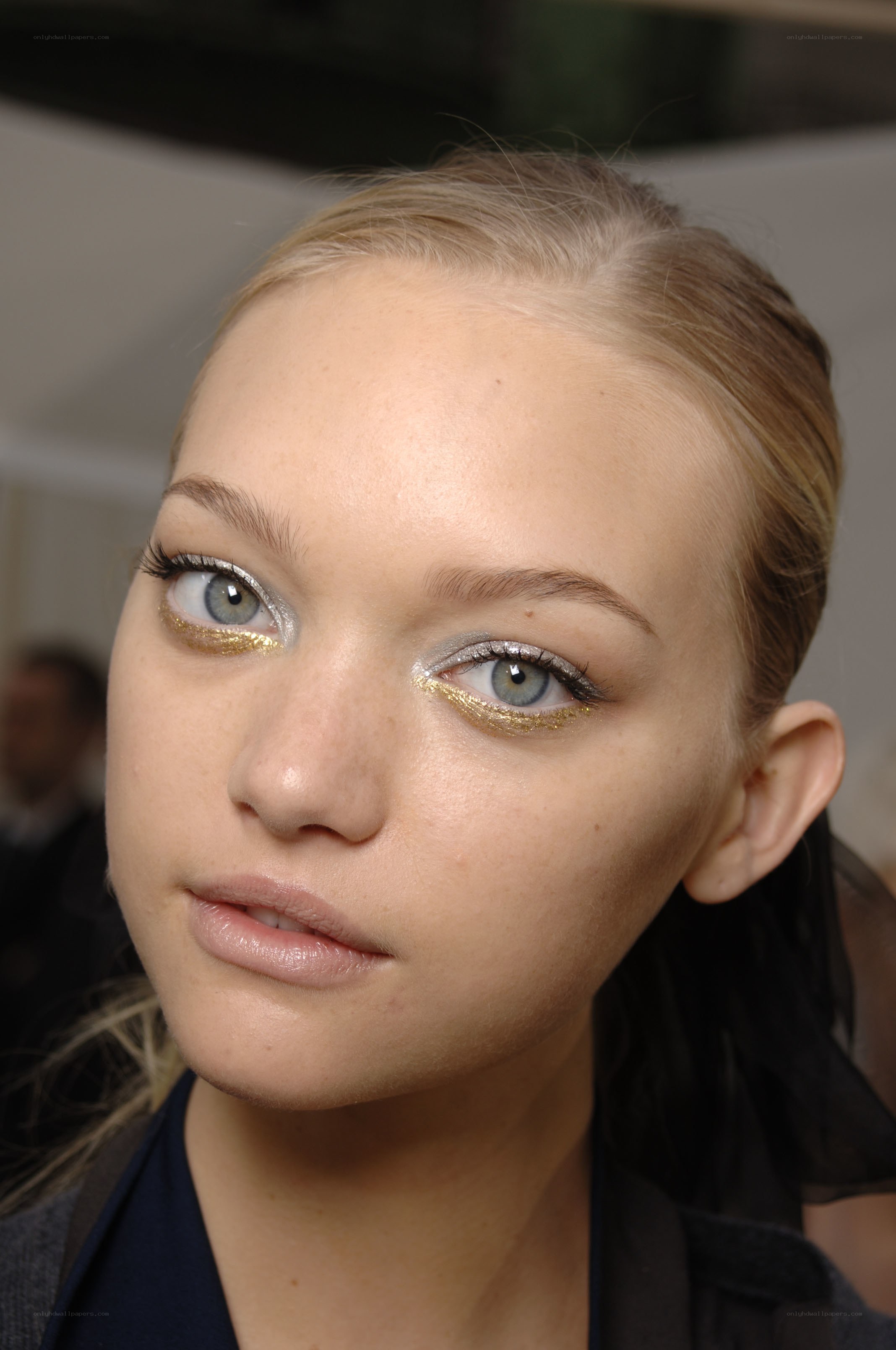 model with gold eye makeup