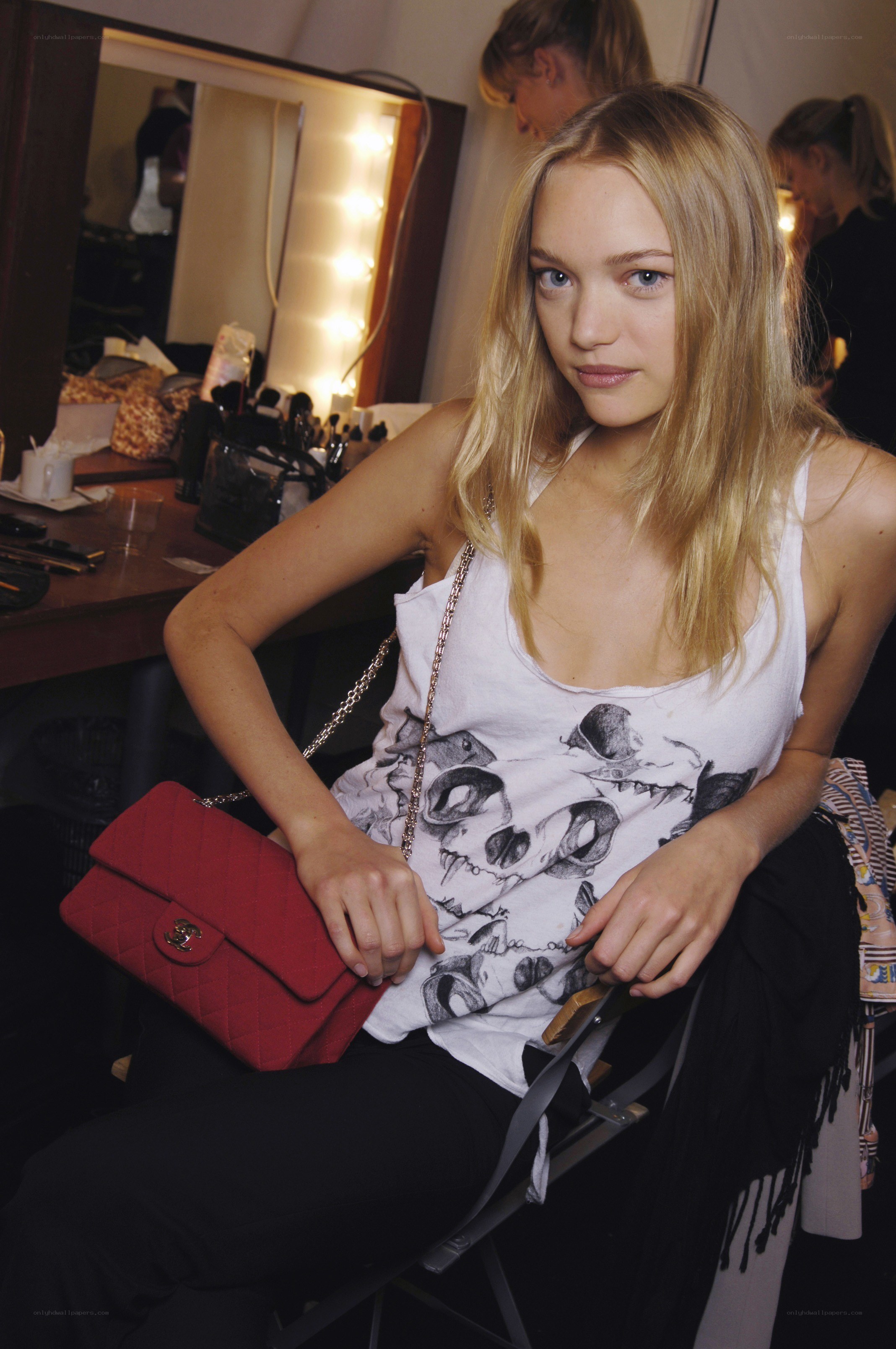 model with red handbag