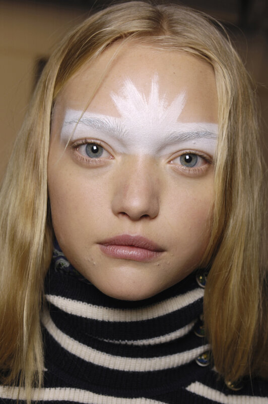 model with white face paint