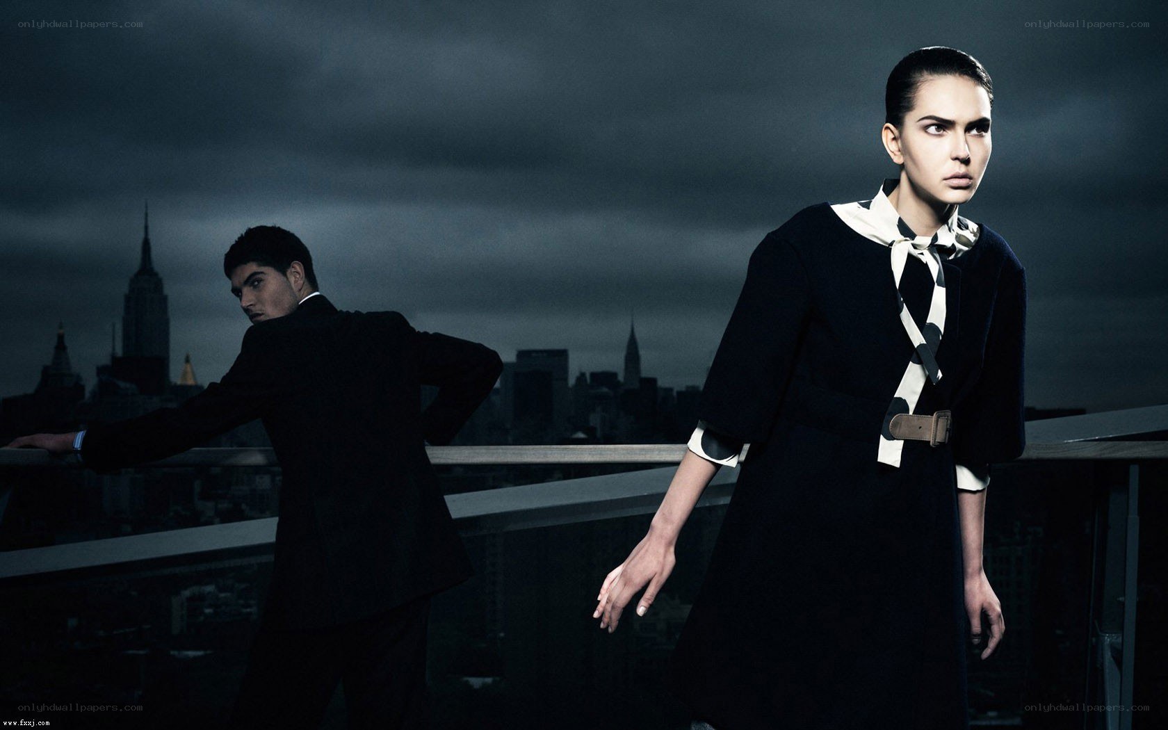 models on a rooftop at night