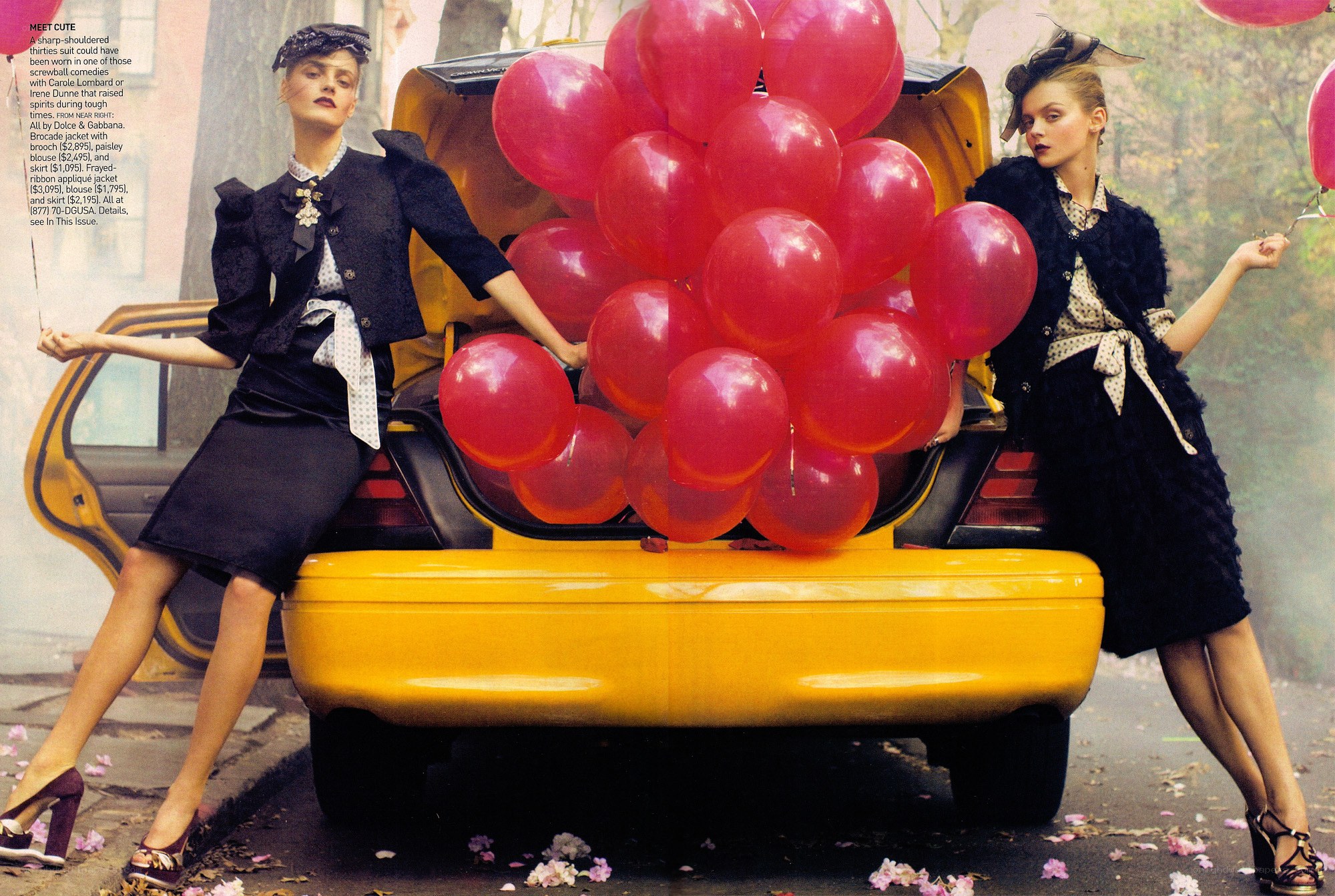 Models with red balloons in car