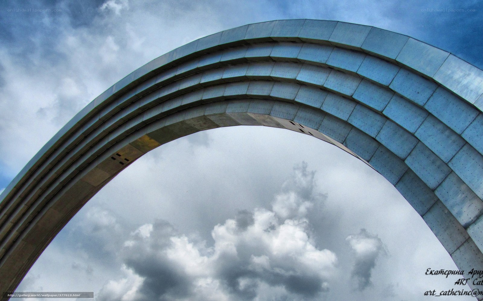 Modern Arch Against Cloudy Sky