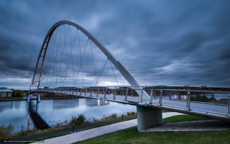 Modern arch bridge over river