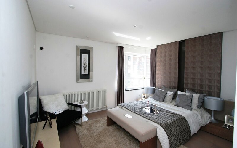 modern bedroom with bed and TV