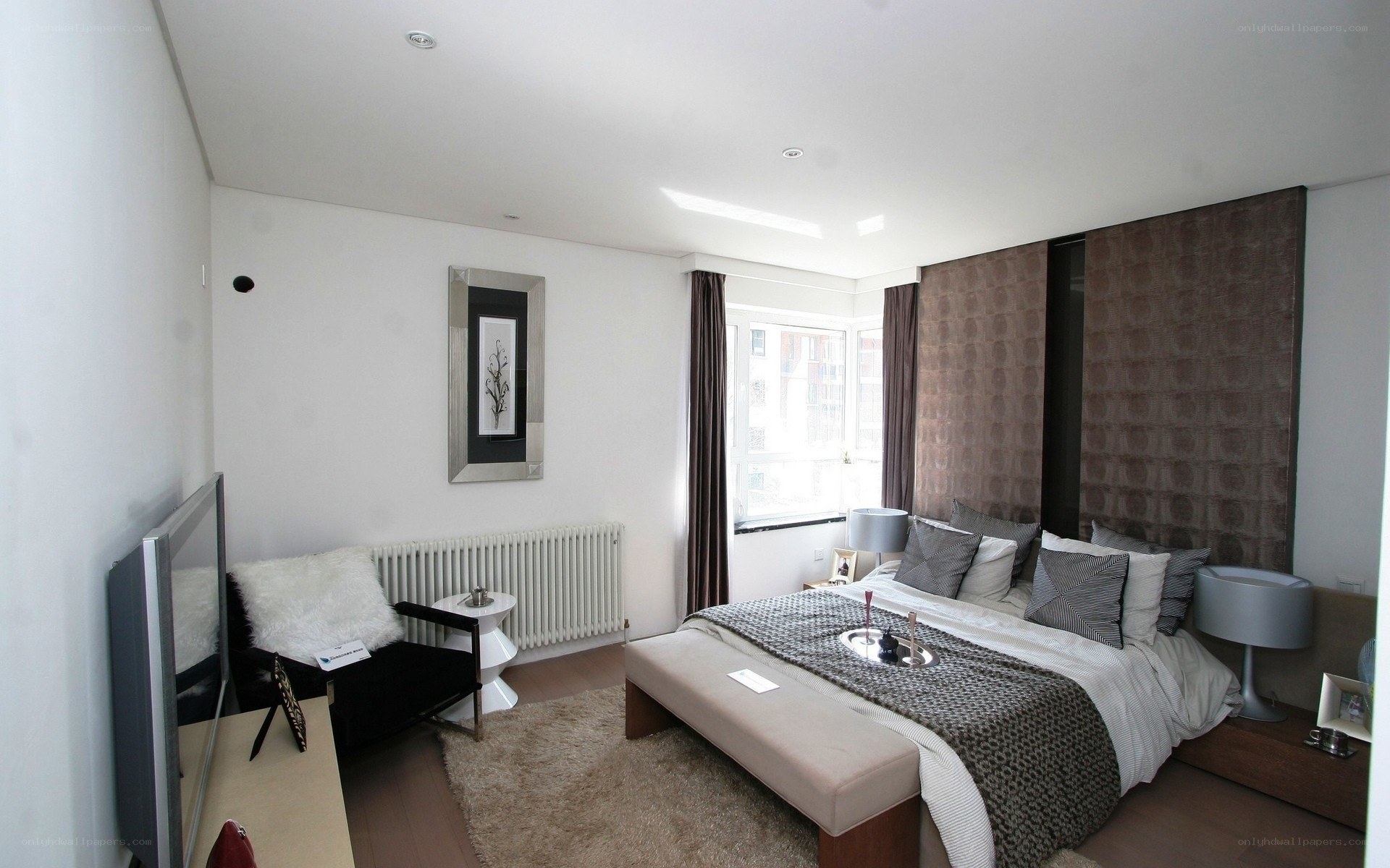 modern bedroom with bed and TV