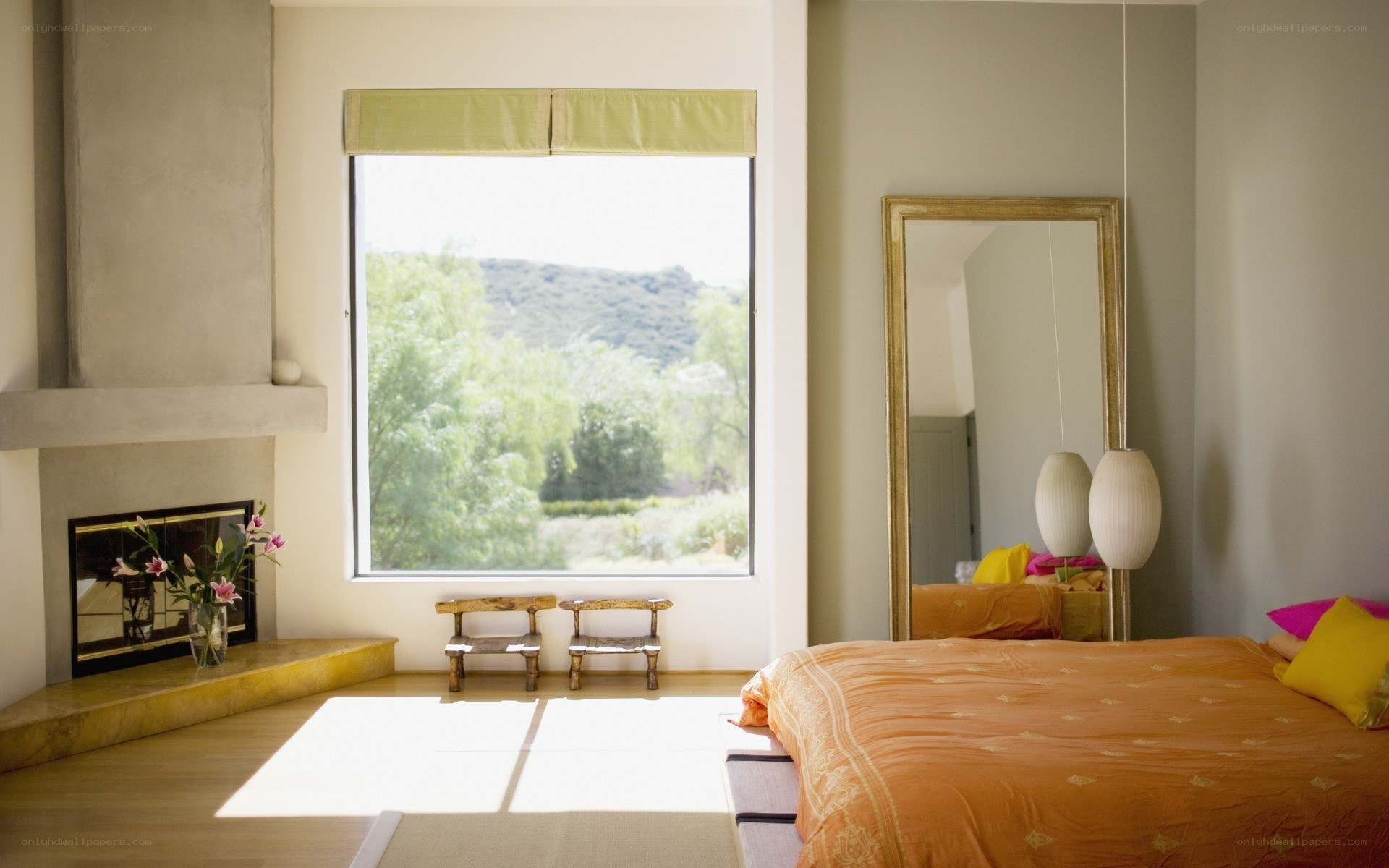 Modern bedroom with fireplace and view