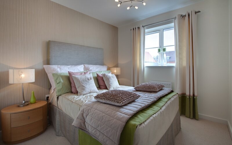 Modern bedroom with green accents