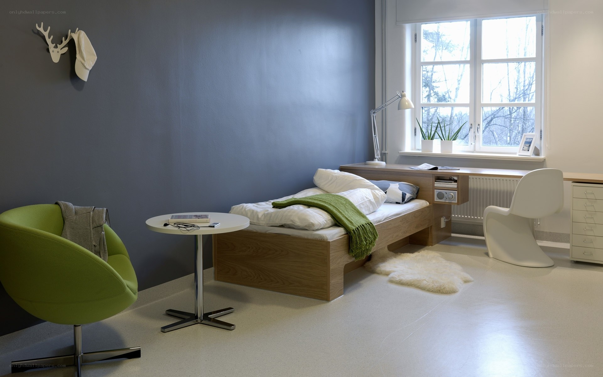 Modern bedroom with green chair