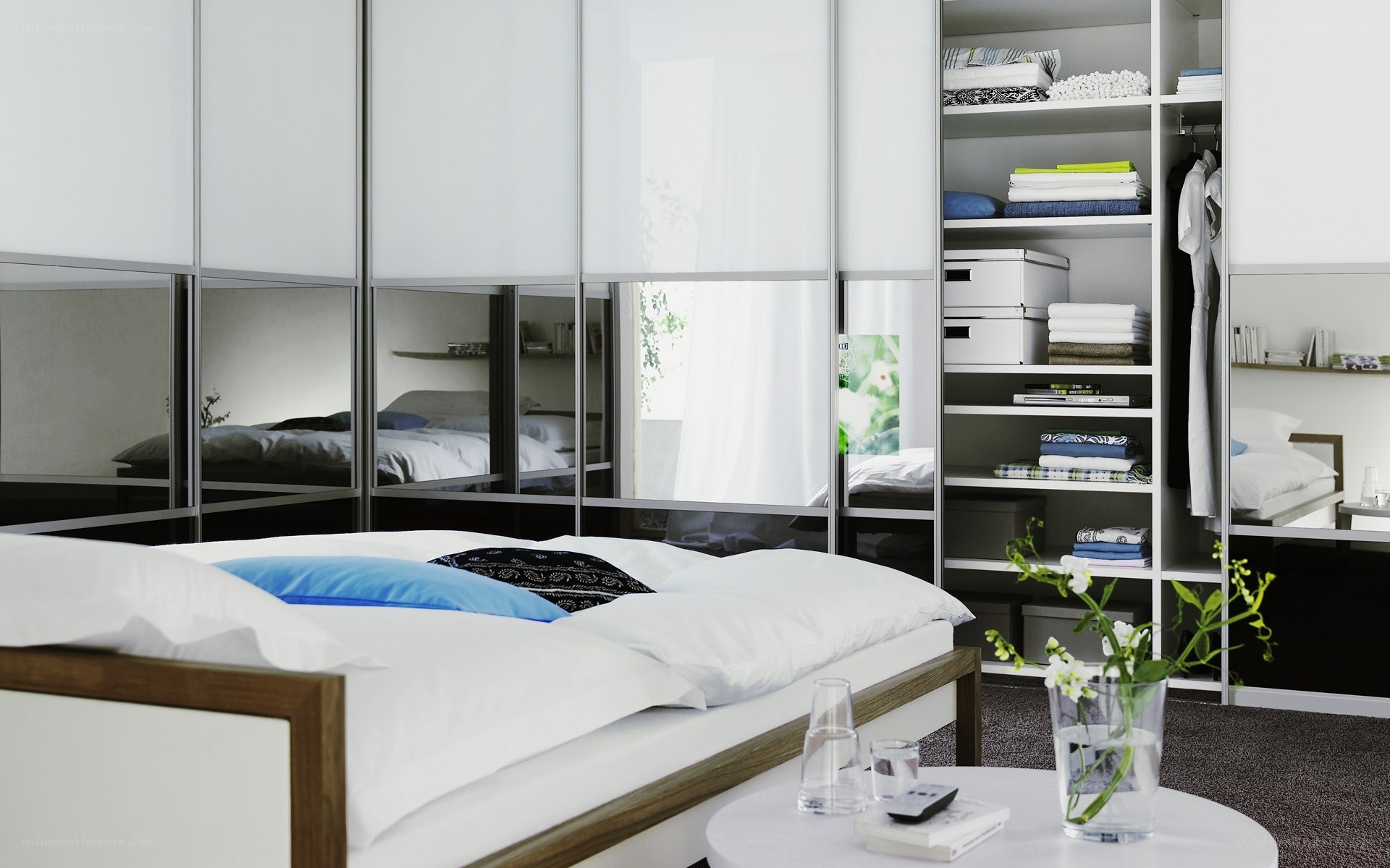 Modern bedroom with mirrored wardrobe