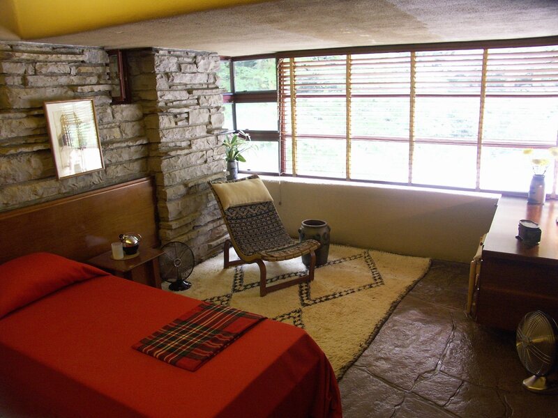 Modern bedroom with stone walls