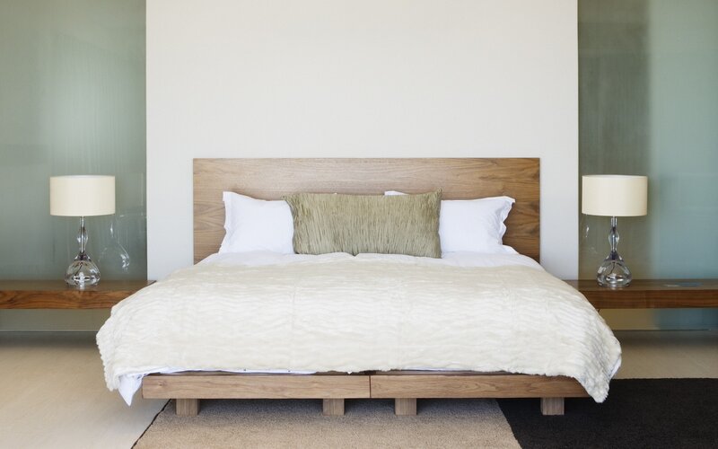 Modern bedroom with wooden bed