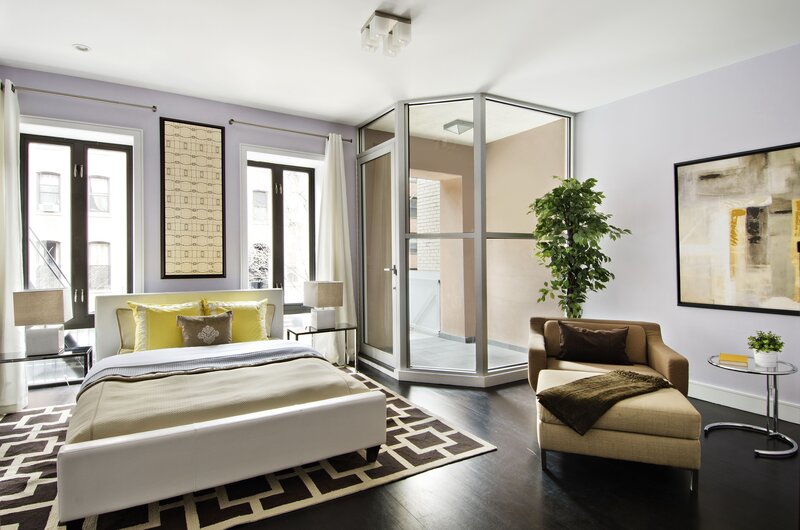 Modern bedroom with yellow accents