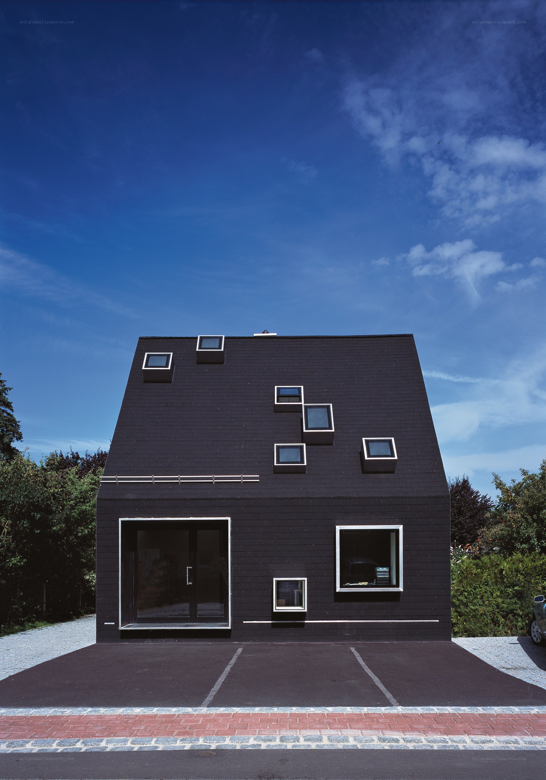 Modern black house with unique windows