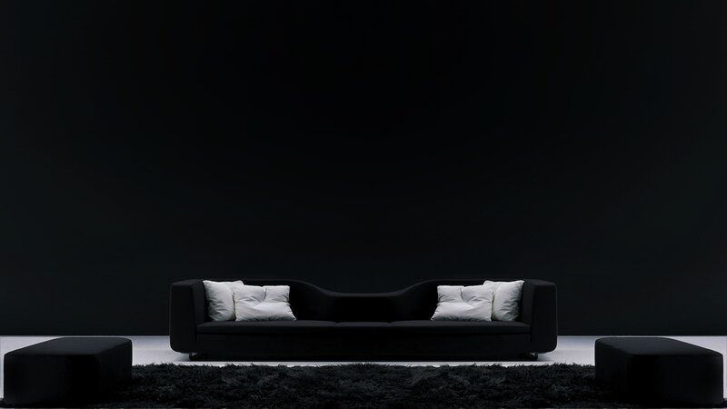 Modern black sofa in dark room