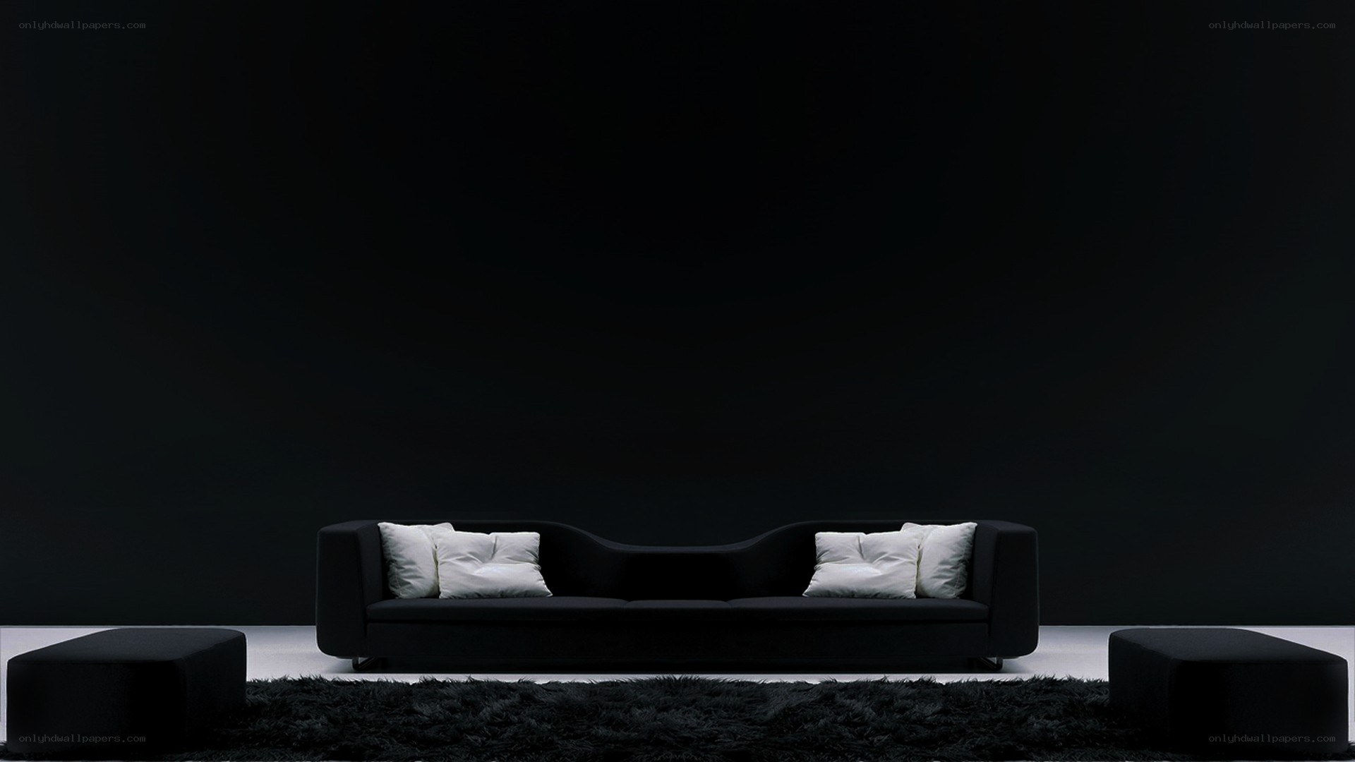 Modern black sofa in dark room