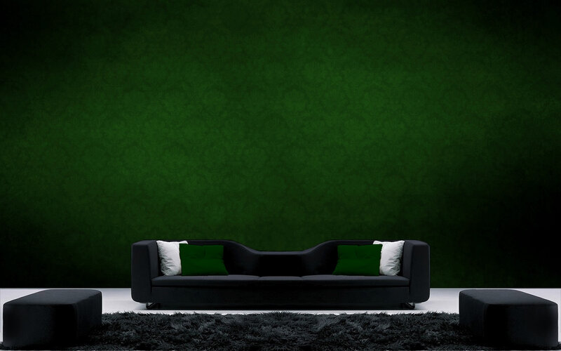 Modern black sofa in green room