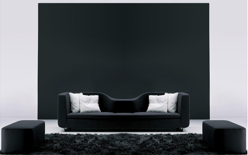 Modern black sofa in minimalist room