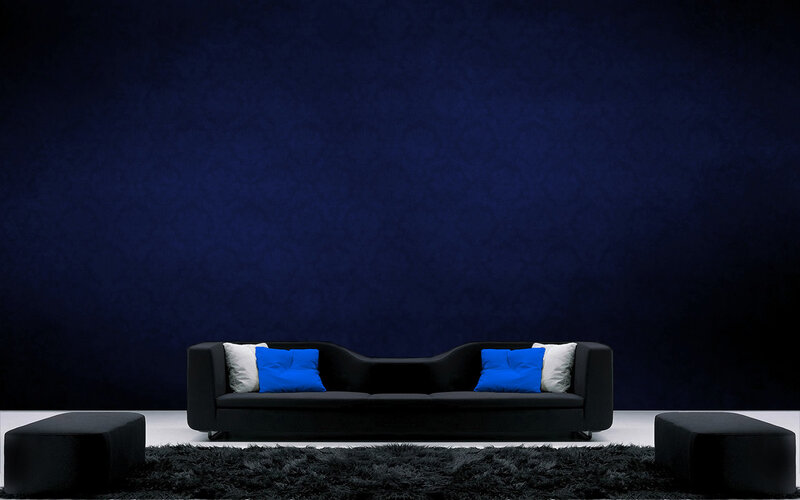 Modern black sofa with blue pillows