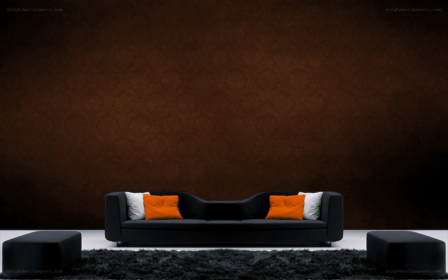 Modern black sofa with orange pillows