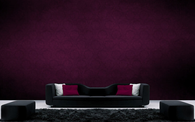 Modern black sofa with purple wall