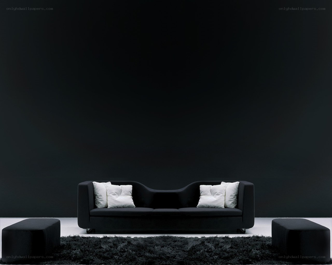 Modern black sofa with white pillows