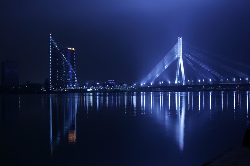 Modern Bridge at Night — Blue, Serene, Photograph, River, Skyscraper, City Lights