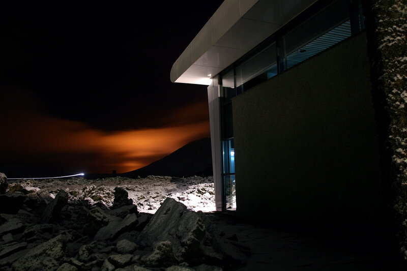 Modern building at night with aurora