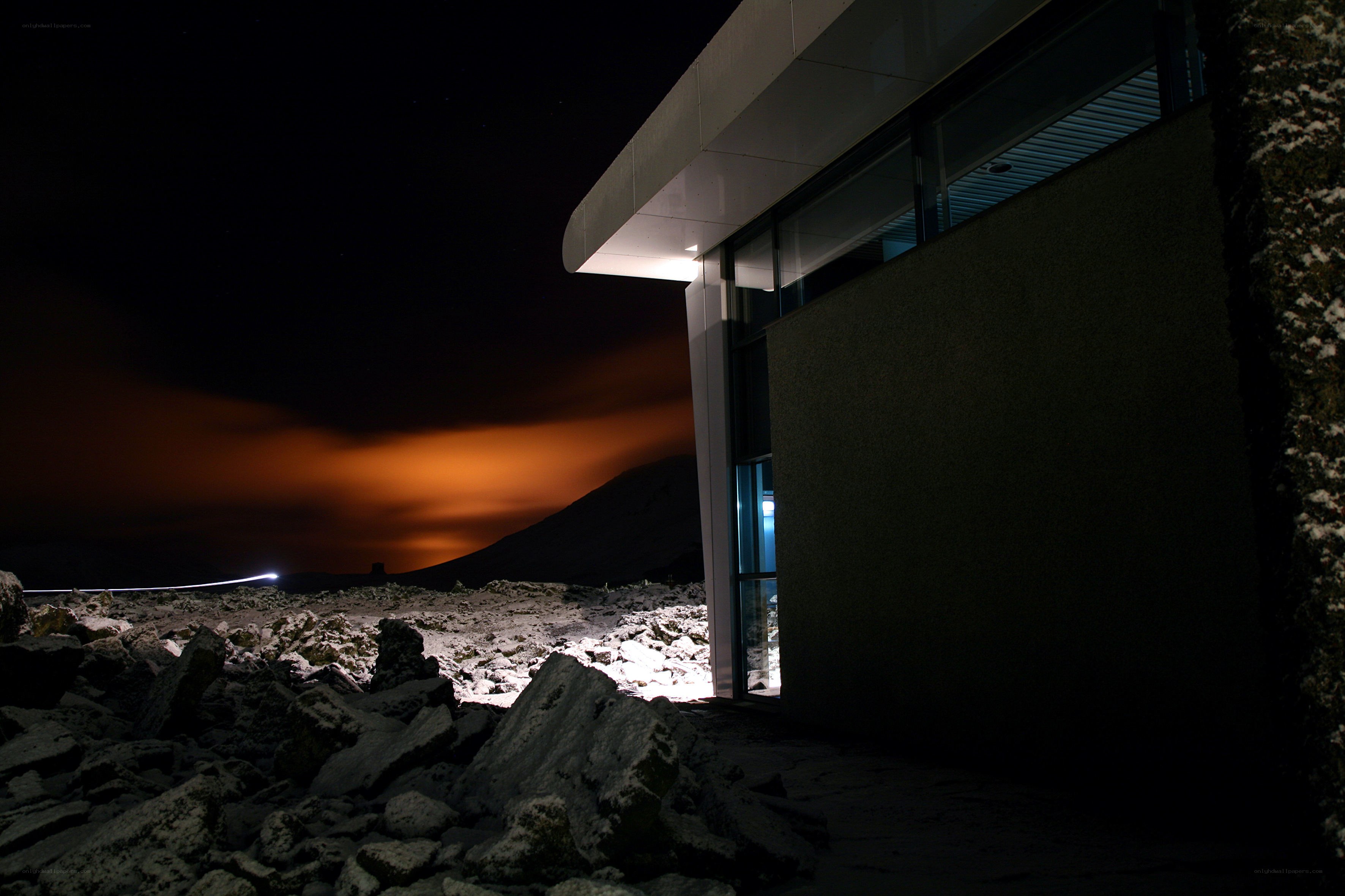 Modern building at night with aurora
