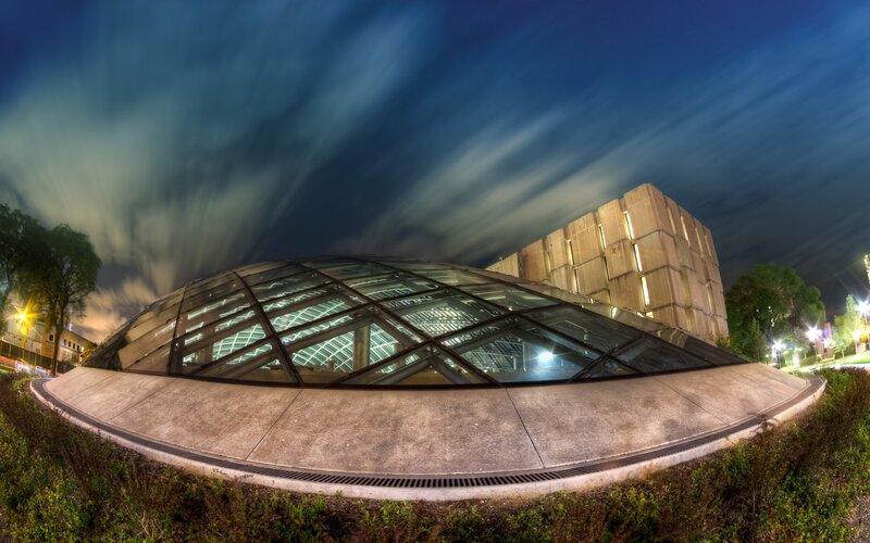 Modern building at night with glass dome
