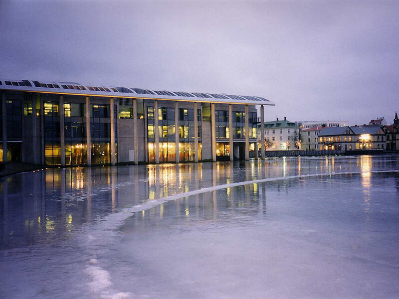 Modern building by frozen water