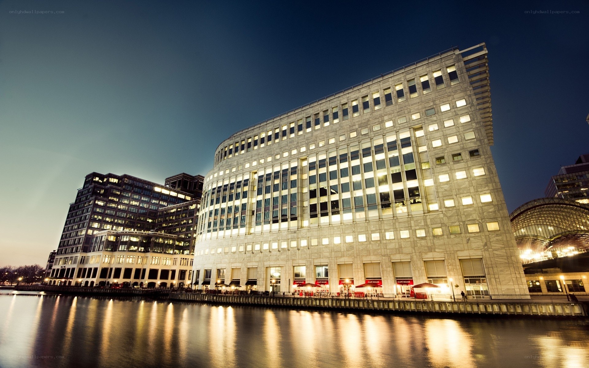 Modern building by the river at night