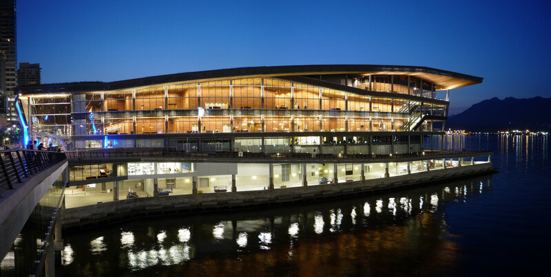 modern building by the water at dusk