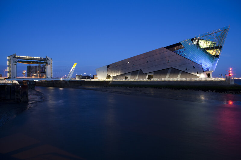 Modern building by the water at dusk