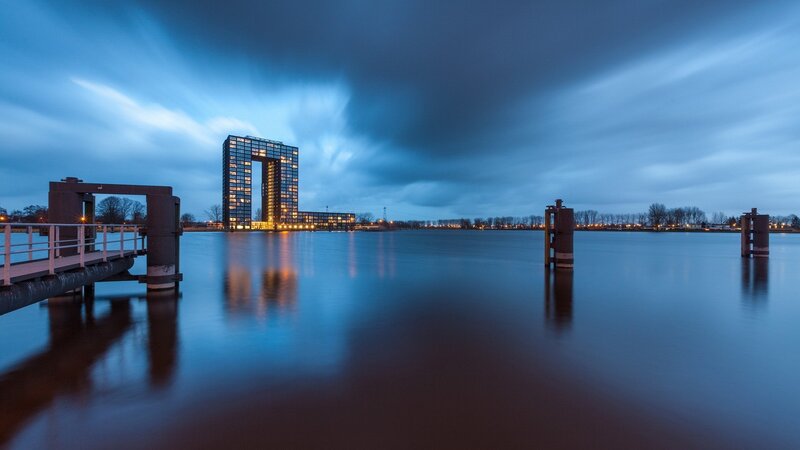 Modern Building by Water — Blue