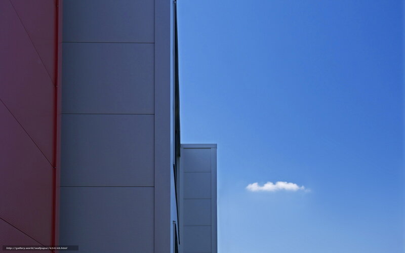 Modern building facade against blue sky