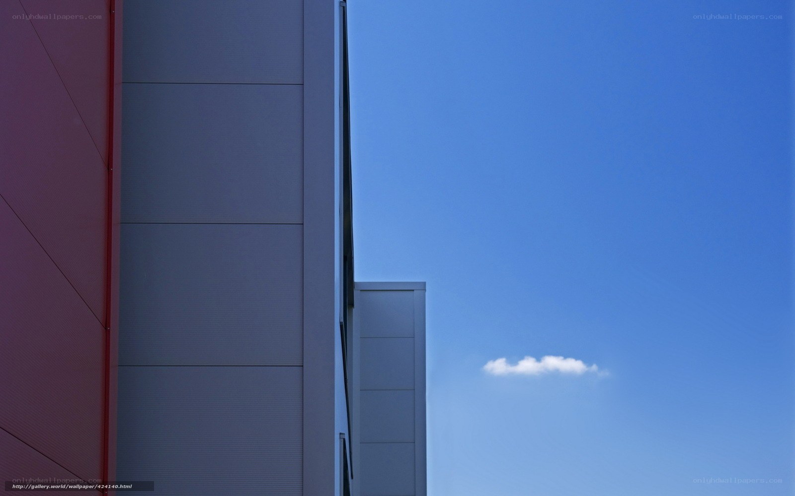 Modern building facade against blue sky