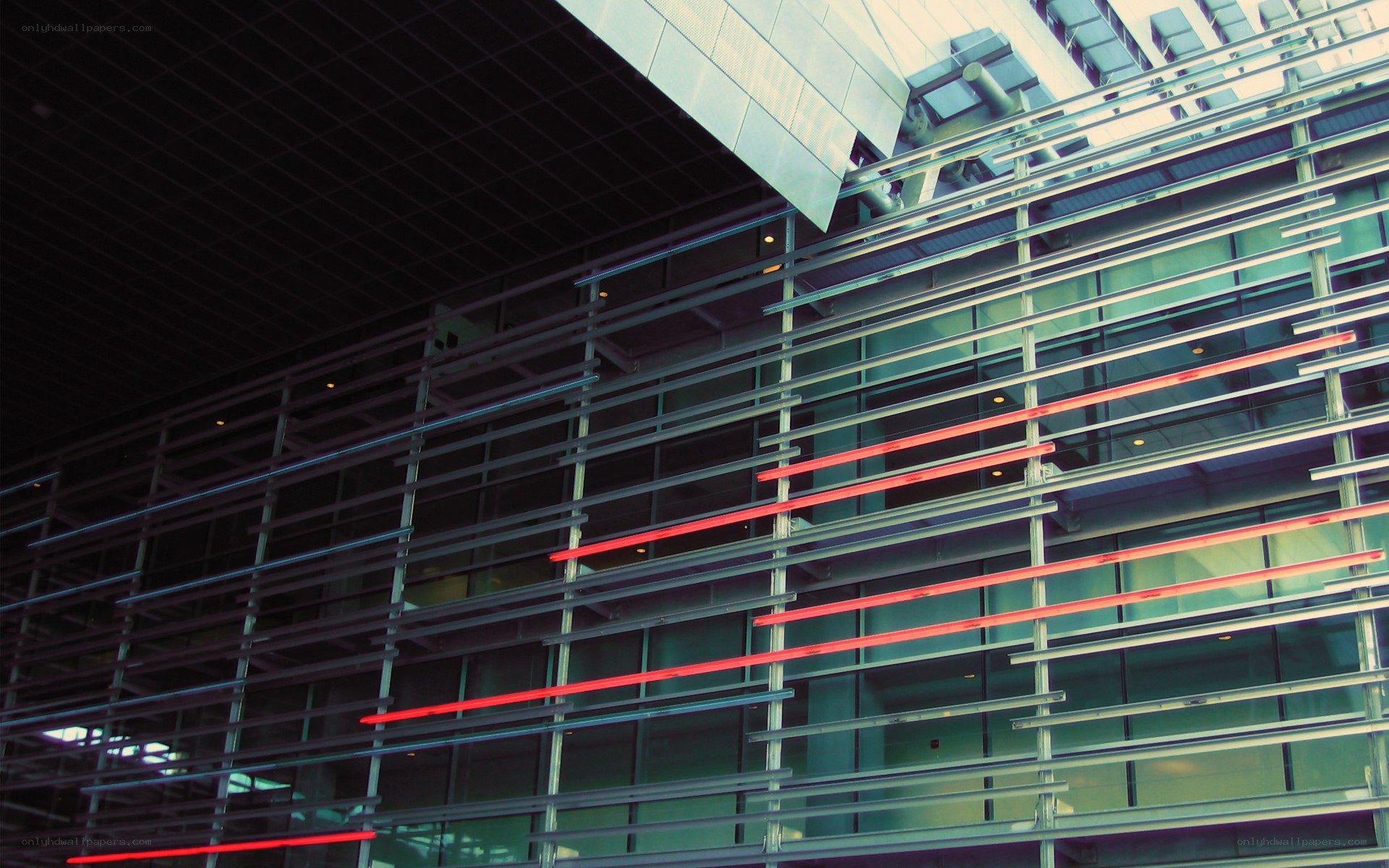 Modern building facade with red lights