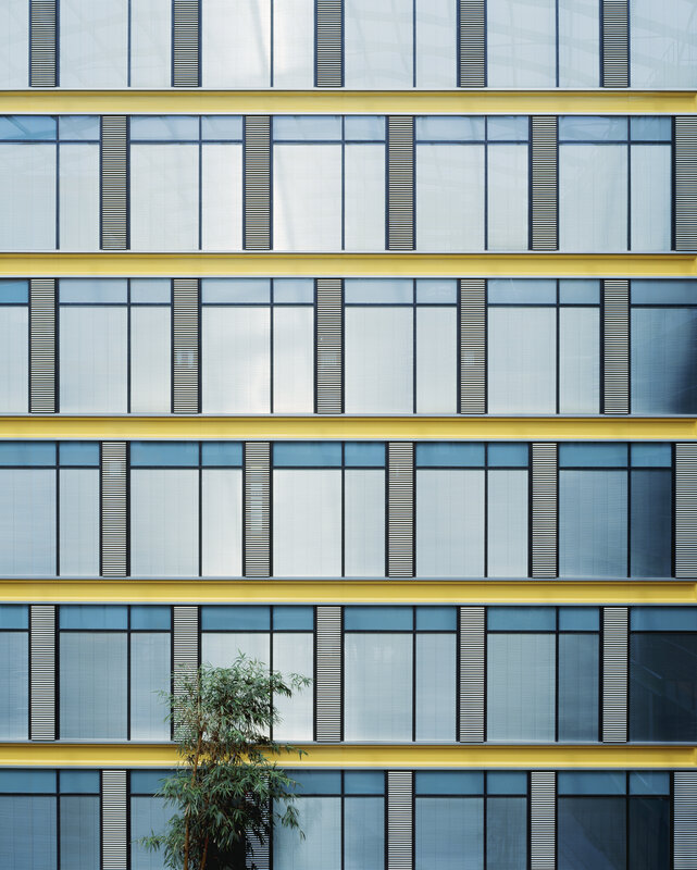 modern building facade with yellow accents