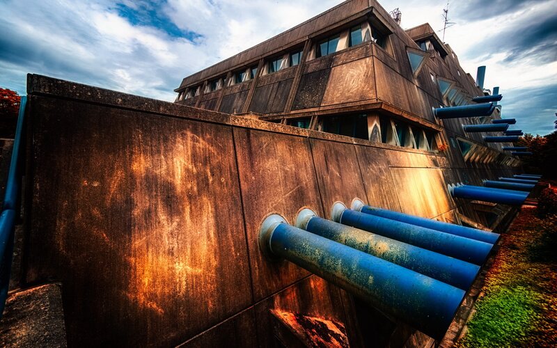 Modern building with blue pipes