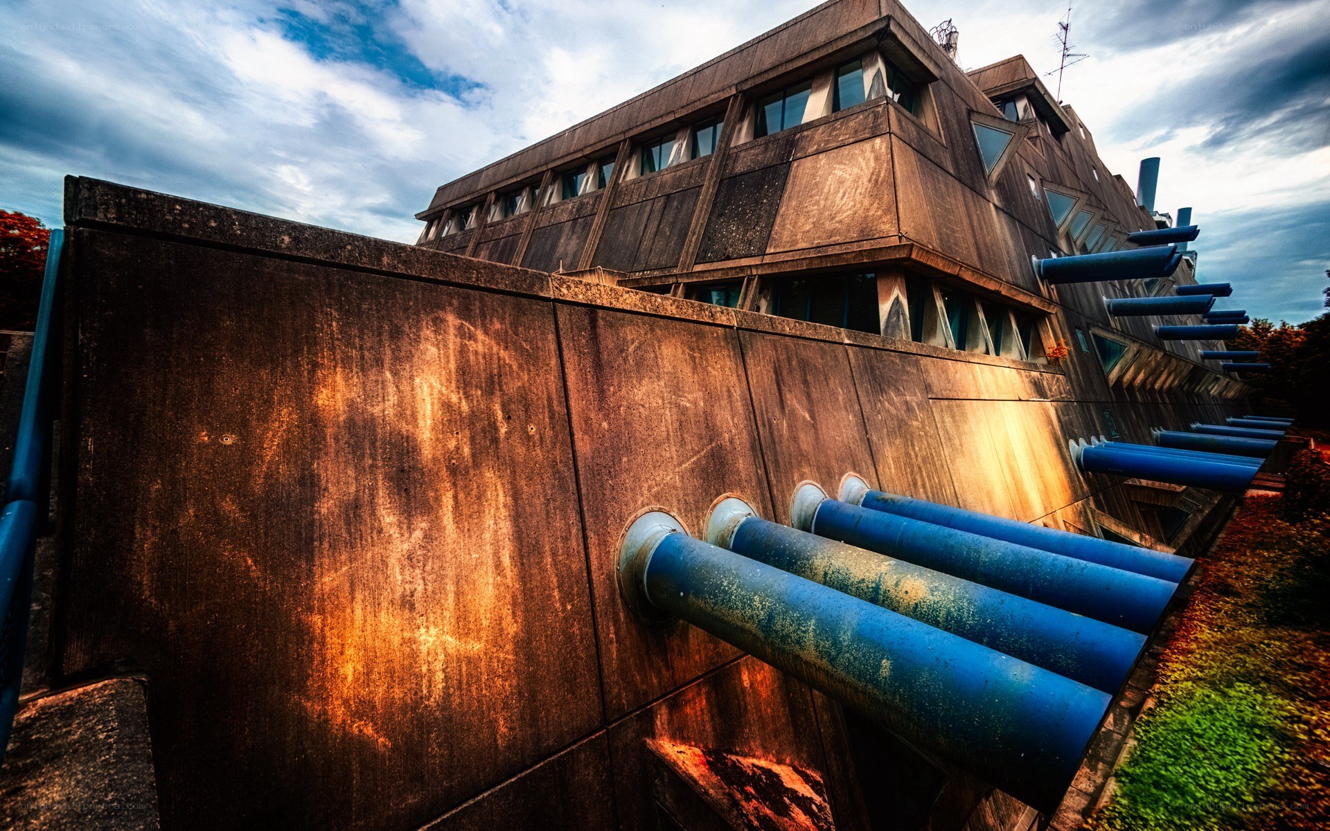 Modern building with blue pipes