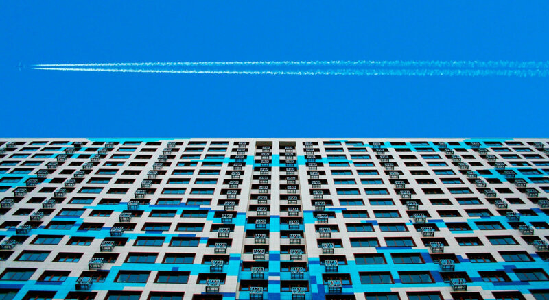 Modern building with contrail