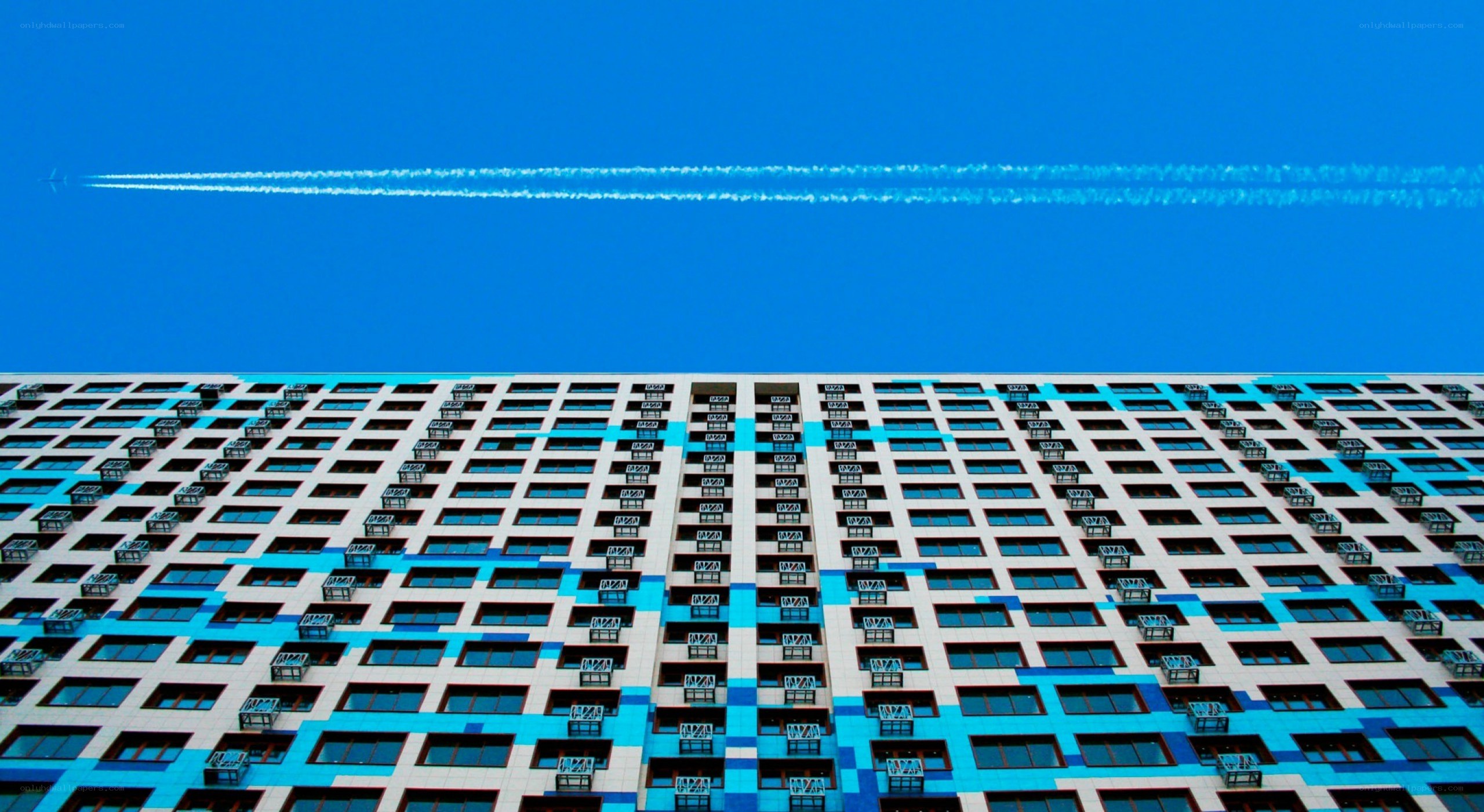Modern building with contrail