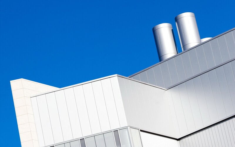 modern building with exhaust pipes