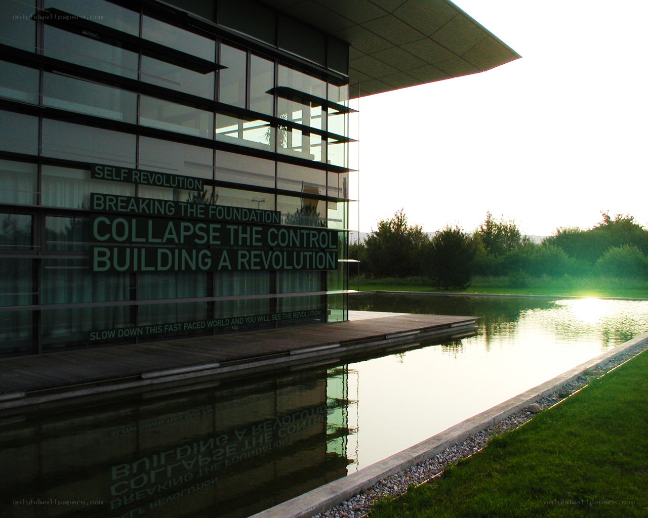 Modern building with reflective water