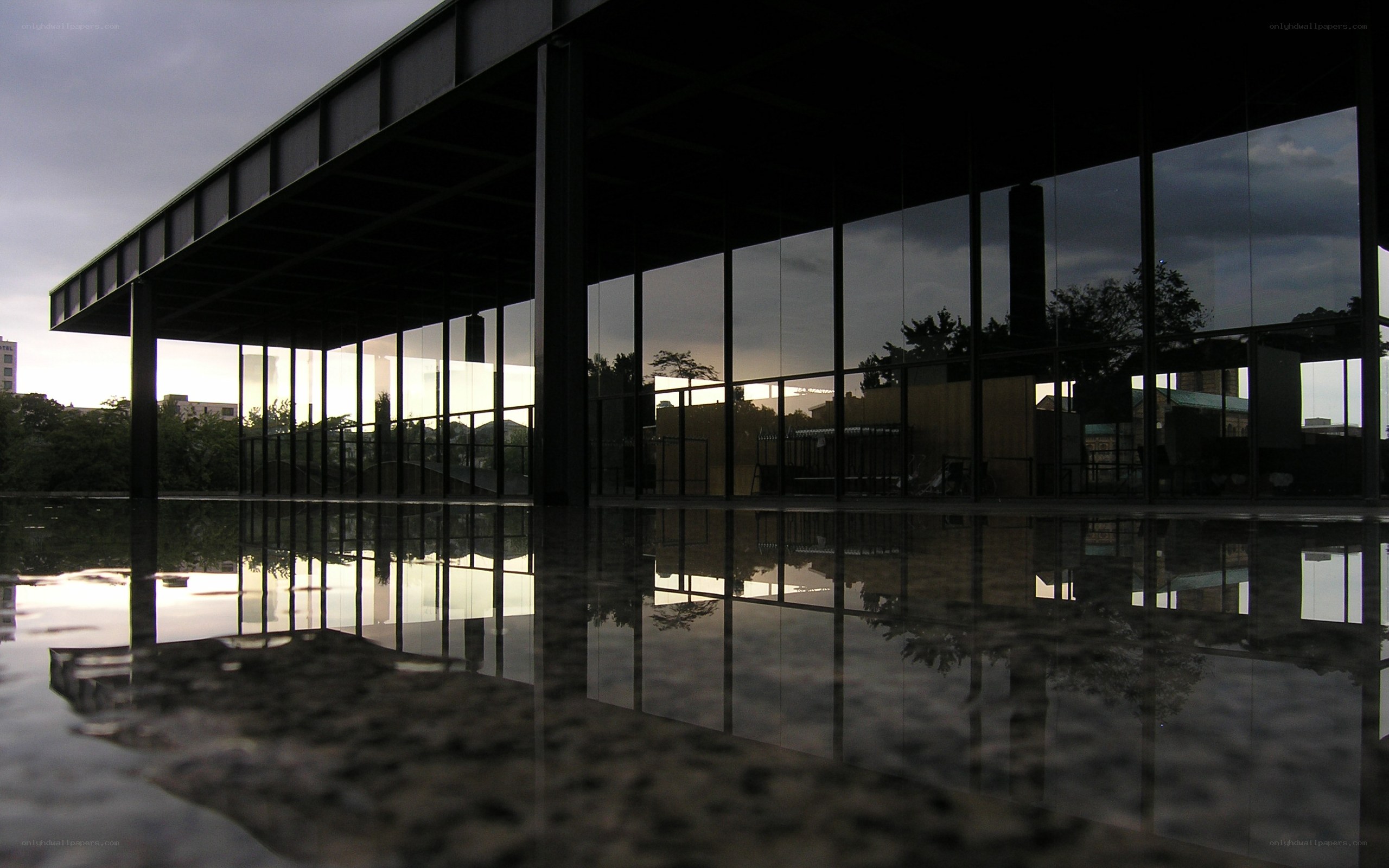 Modern building with reflective water