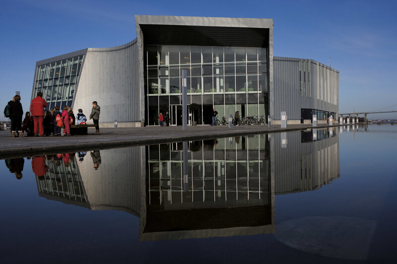 Modern building with water reflection