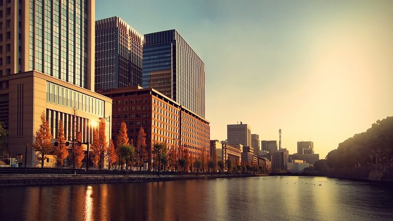 Modern Buildings by River — Orange, Serene, Sunset